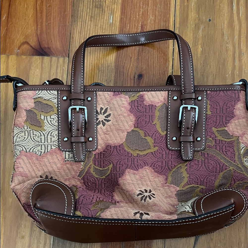 Floral canvas print Fossil purse with brown handles trimmed in white stitches